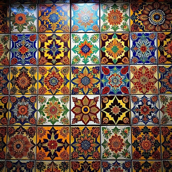 Add a splash of color to your desktop or mobile with this beautiful tile wallpaper. The intricate patterns and vivid colors will bring energy and warmth to any space.